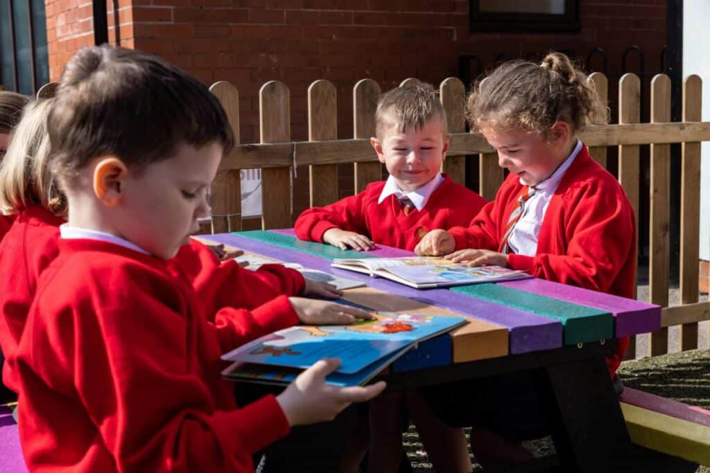 Holmfirth picnic table at Kirkham and Wesham Primary School - kids reading