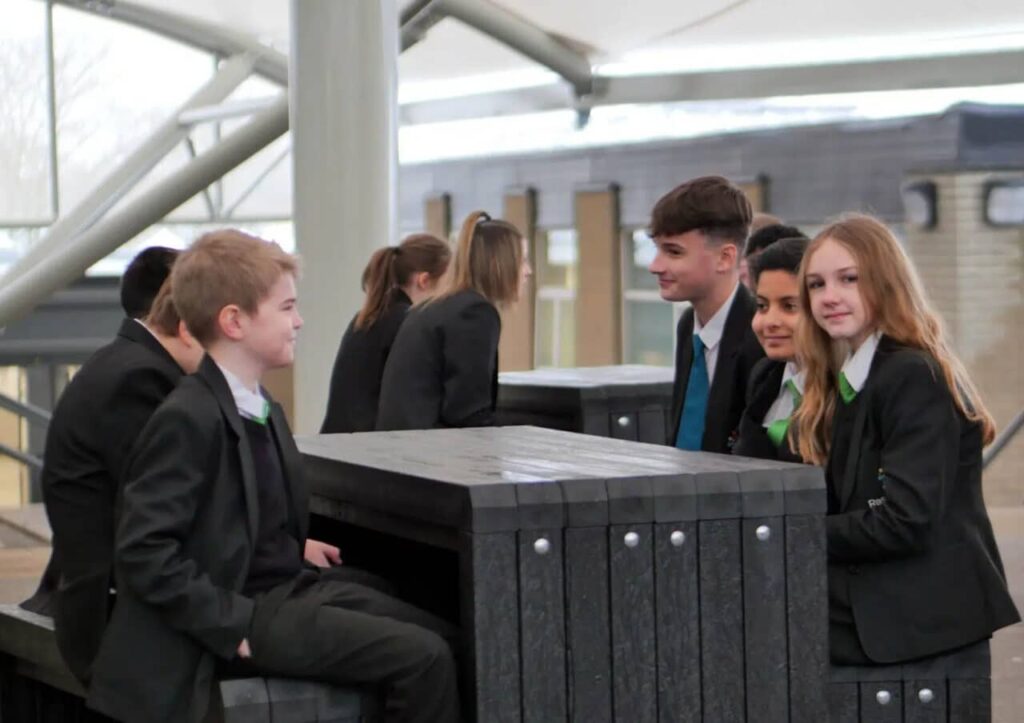Students at Rastrick School at a recycled plastic table