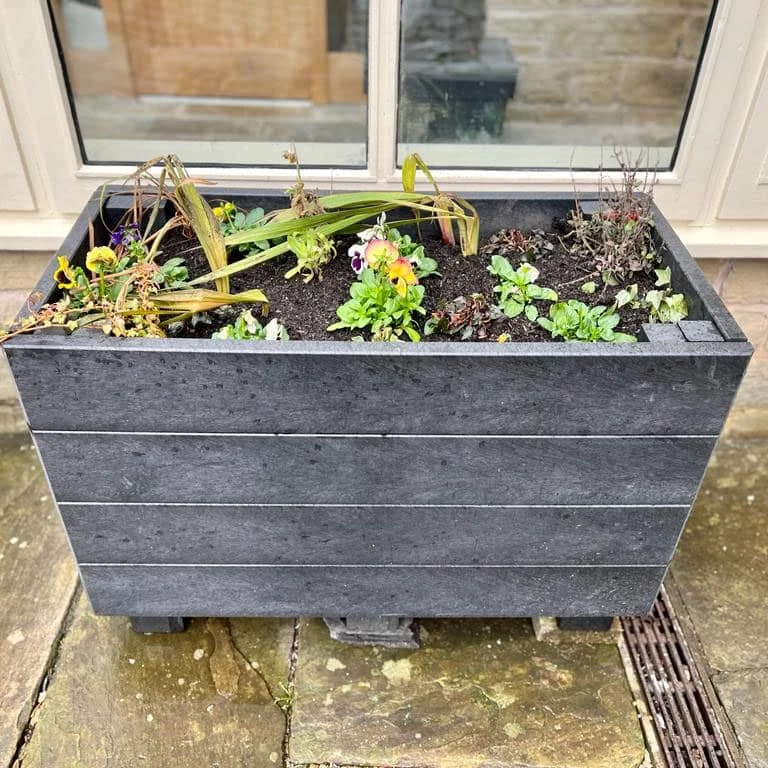 A rectangular Marsden recycled planter outside Marsden Mechanics