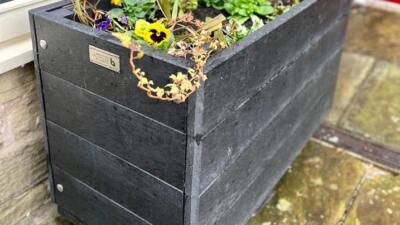 A rectangular Marsden recycled planter outside Marsden Mechanics. Planters