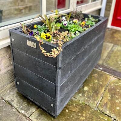 A rectangular Marsden recycled planter outside Marsden Mechanics. Planters