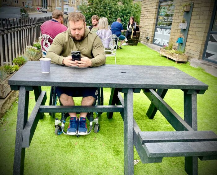 The Bradshaw wheelchair accessible recycled picnic table is now also available with a double cut-out so two wheelchair users can use it at the same time.