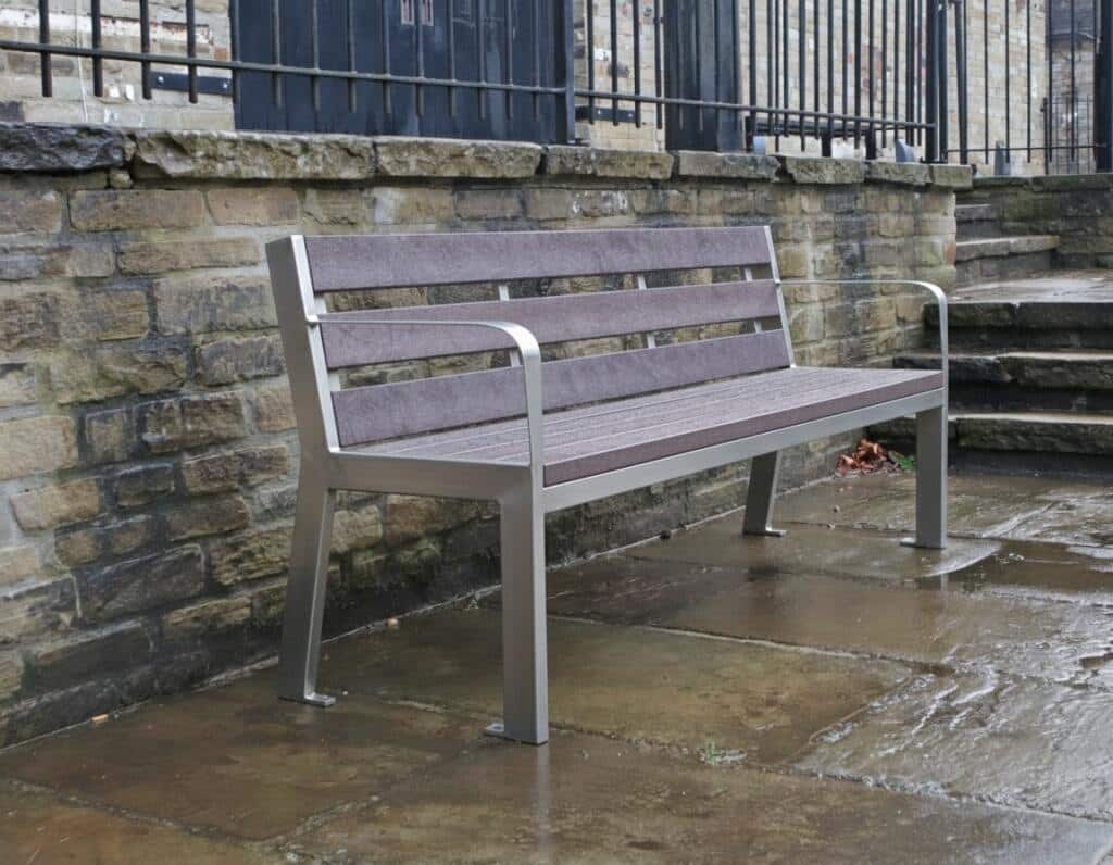 The elegant York steel and recycled plastic bench is a future classic with is its gently sloping back and smooth, curved armrests.