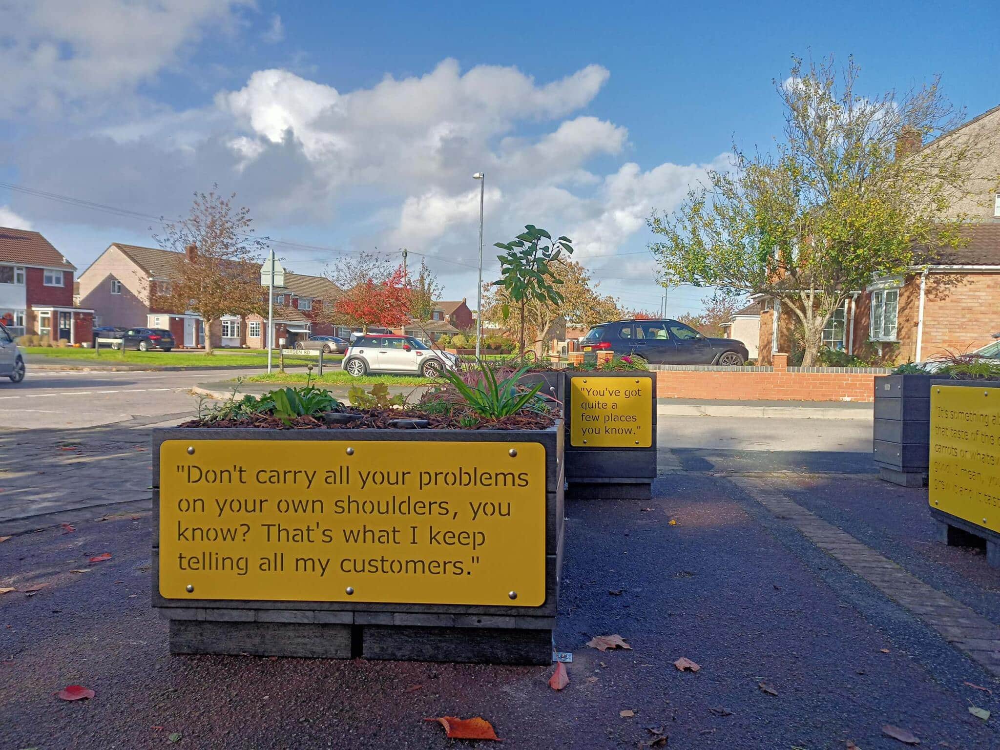 Modular parklet made from artificial lumber on the corner in a residential area.