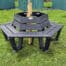 Wrap around hexagonal bench with tree in the center.