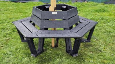 Wrap around hexagonal bench with tree in the center.