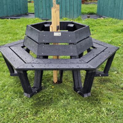 Wrap around hexagonal bench with tree in the center.