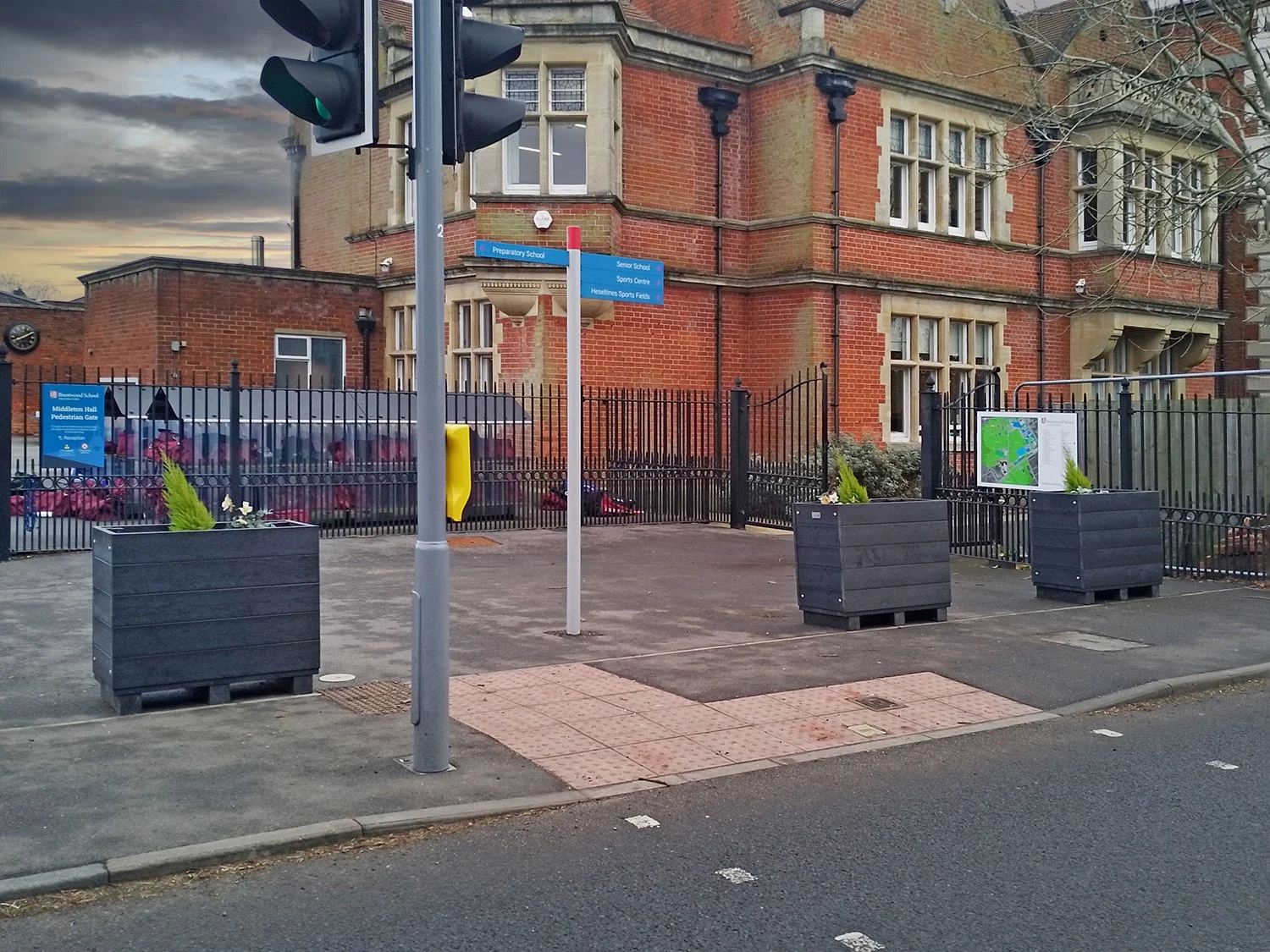 Planters used in front of brentwood school to mitigate school drop off pollution