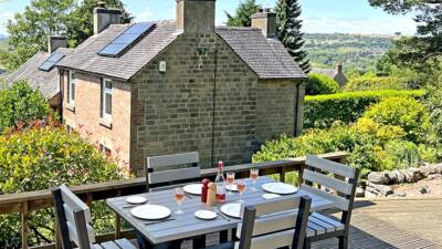 Small grey Birchcliffe dining set made from recycled plastic, set up on an outdoor deck, perfect for enjoying meals al fresco.