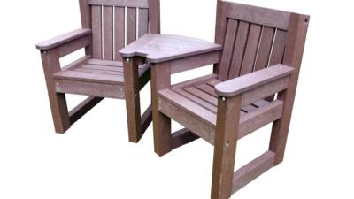 Queensbury small space outdoor seating set made from recycled plastic, featuring two durable brown chairs with a connecting corner table, designed for gardens, care homes, cafes, and small outdoor spaces.