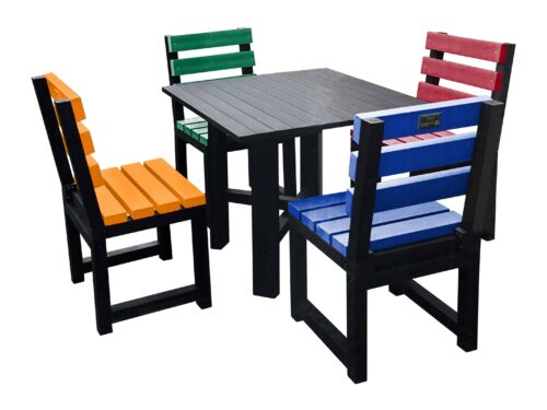 Black square table with multi-coloured chairs (orange, green, red, and blue) made from recycled plastic.