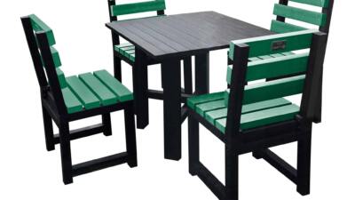 Black square garden table with four green chairs made from recycled plastic.