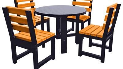 Black round garden table with four yellow chairs made from recycled plastic.