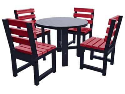Black round garden table with four red chairs made from recycled plastic.