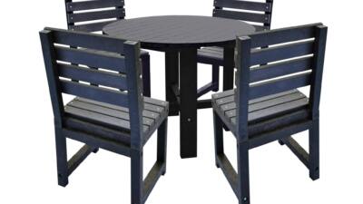 Black square garden table with matching black chairs made from recycled plastic.