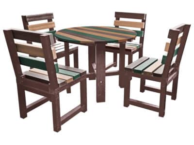 Black round table with multi-coloured chairs (orange, green, red, and blue) made from recycled plastic.