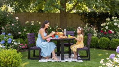 daughter and mother sat in garden at a British Recycled Plastic round Featherstone dining set