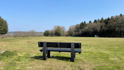 rear view of a black british recycled plastic buddy bench made from artificial lumber outdoor bench
