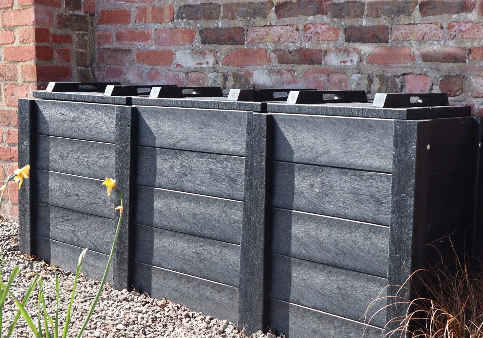 The Callis Compact recycled plastic composter, seen here in triple format, can also be supplied as a single or double bin. The Callis Compact recycled plastic composter, seen here in triple format, can also be supplied as a single or double bin.
