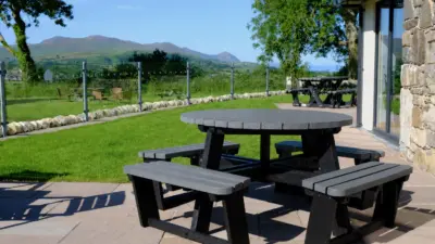 Outdoor recycled plastic round seating with scenic mountain view