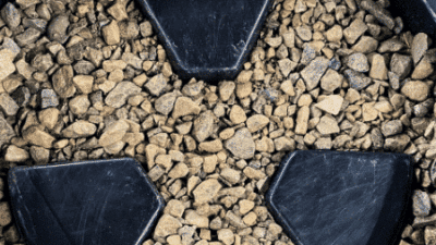 recycled plastic litter bin bottom on the gravel