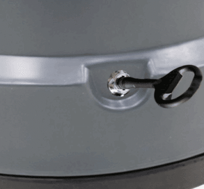 Black key unlocking the lid of a recycled plastic litter bin