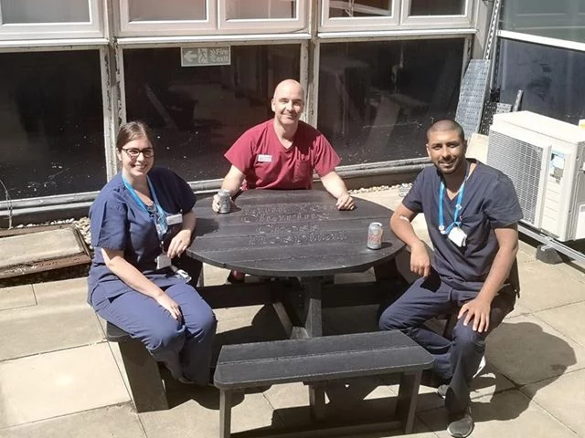 Medical staff taking a well earned break at Charing Cross Hospital during the pandemic at a British Recycled Plastic circular Calder picnic table. Medical staff taking a well earned break at Charing Cross Hospital during the pandemic at a British Recycled Plastic circular Calder picnic table.