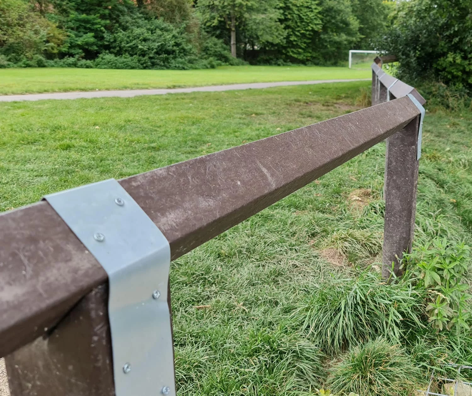 Denholnme black picnic benches at a golf club