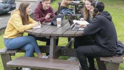 Students studying together at a British Recyled Plastic Calder picnic table