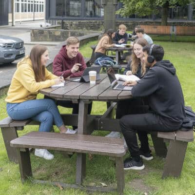 Students studying together at a British Recyled Plastic Calder picnic table