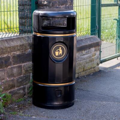recycled plastic litter bin near a school