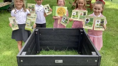 Children readt to start growing their first food at a school with their British Recycled Plastic raised bed