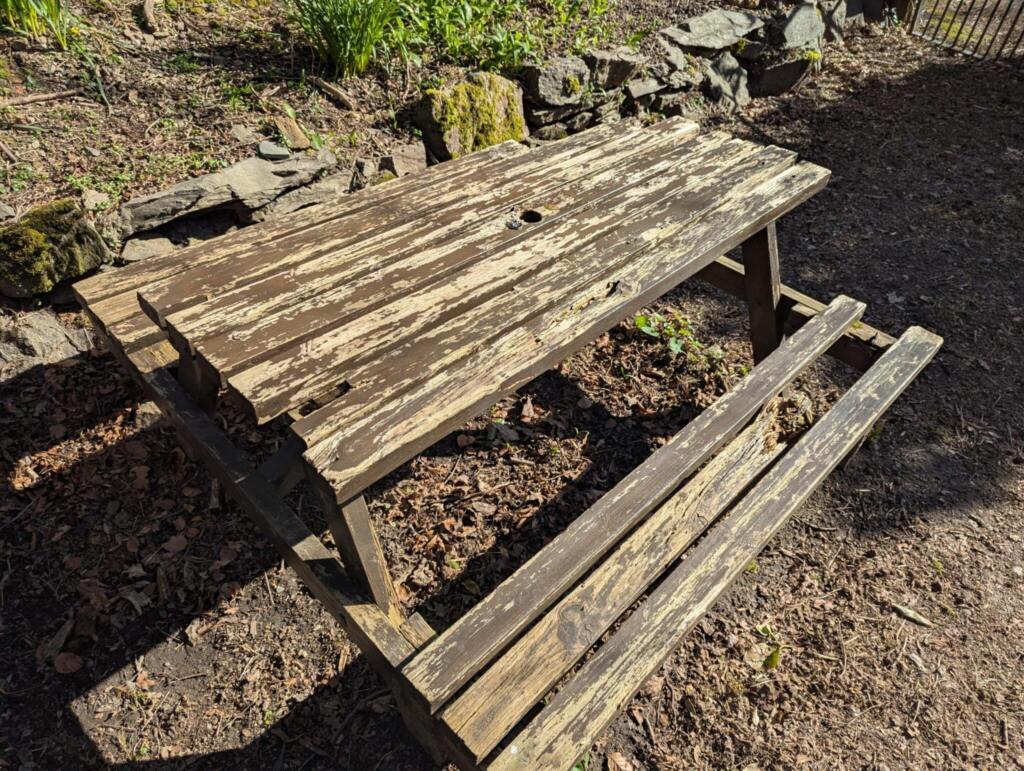 Rotten wooden picnic bench