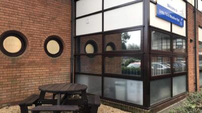 A calder round picnic table outside an nhs hospital