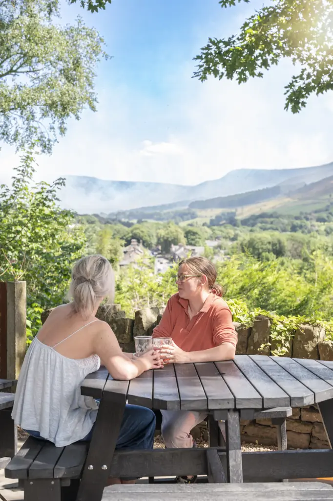 rishworth portrait Two women smiling whilst sat at a British recycled Plastic Picnic table at a pub beer garden