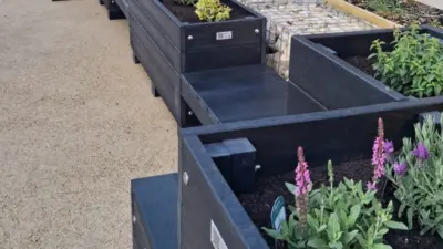rectangular recycled plastic parklet and planters with flowers