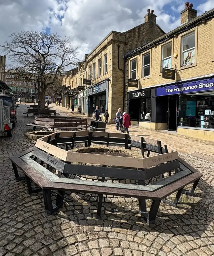 One of the complete hexagonal tree benches made from British Recycled Plastic, sat outside the Woolshops Shopping Centre in Halifax, UK.